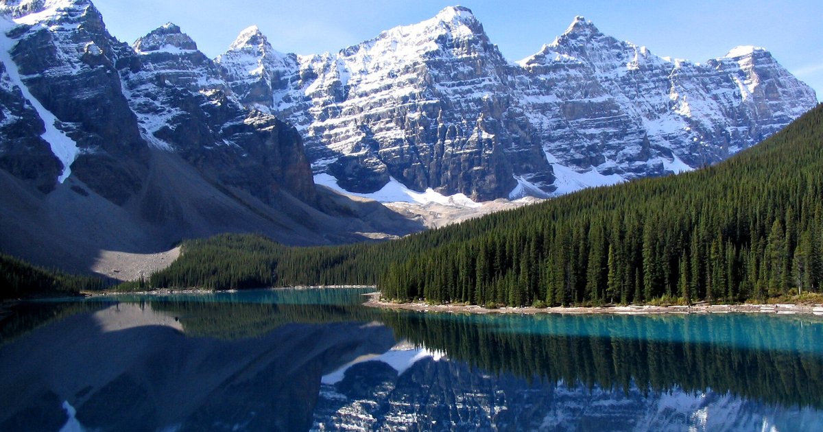 Mountains reflected in a turquoise lake